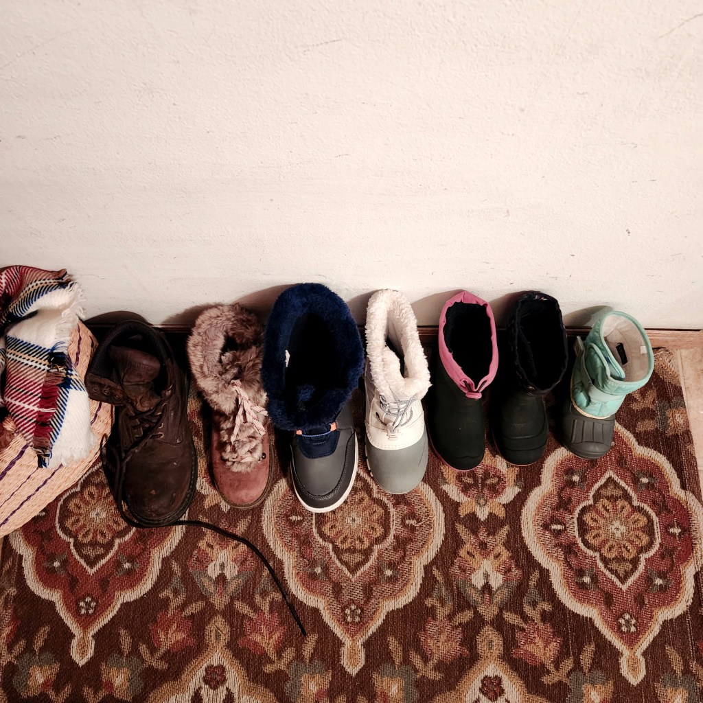 Each Chose a Boot to Line by the&nbsp;Wall;